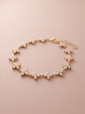 Bracelet Lyana – Fleurs Serties de Strass – Doré